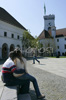 People are enjoying sunny and warm spring day in Ljubljana Castle yard. Ljubljana Castle (Ljubljanski grad) is the most spectacular sight of Ljubljana. There is proven evidence that the hill on top of which it is situated was inhabited back in the 12th century BC Preserved from this early period of settlement are the remains of the Urn Tomb culture. <br> Ljubljana Castle is a major tourist attraction and a picturesque venue of numerous cultural events including concerts, theatre performances, exhibitions, congresses and official receptions, which add a special flavour to the lively pulse of life in Ljubljana.
