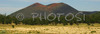 Sunset crater volcano viewed from Bonito meadows. Sunset crater volcano is situated in Sunset Crater volcano National monument near Flagstaff, AZ, USA. Its last eruption was around year 1250.
