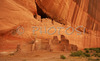 White house ruin below in Canyon de Chelly. White house was built  by ancient Puebloan people and occupied around 1000 years ago.  It is named for the long wall in the upper dwelling that is covered with white plaster. Canyon de Chelly National Monument is located near Chinle, AZ, USA and is hiding numerous house ruins of Navajo Indians, which were settled in Canyon de Chelly. Labyrinth called Canyon de Chelly is really several canyons, which include Canyon de Chelly and Canyon del Muerto. At the mouth of the canyon the rock walls are only 30 feet high. Deeper into the canyons, to the east, the walls rise dramatically until they reach more than 1000 feet above the floor. The cliffs rise straight up, overshadowing the streams, cottonwoods, and small farms below. It has taken about two million years and volumes of water to etch these stone paths through the layers of sandstone and igneous rock as the Defiance Plateau pushed its way upward. Today the canyon still beckons us with its towering stone monoliths and ledges bearing the open windows of ancient people.
