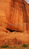 White house ruin below in Canyon de Chelly. White house was built  by ancient Puebloan people and occupied around 1000 years ago.  It is named for the long wall in the upper dwelling that is covered with white plaster. Canyon de Chelly National Monument is located near Chinle, AZ, USA and is hiding numerous house ruins of Navajo Indians, which were settled in Canyon de Chelly. Labyrinth called Canyon de Chelly is really several canyons, which include Canyon de Chelly and Canyon del Muerto. At the mouth of the canyon the rock walls are only 30 feet high. Deeper into the canyons, to the east, the walls rise dramatically until they reach more than 1000 feet above the floor. The cliffs rise straight up, overshadowing the streams, cottonwoods, and small farms below. It has taken about two million years and volumes of water to etch these stone paths through the layers of sandstone and igneous rock as the Defiance Plateau pushed its way upward. Today the canyon still beckons us with its towering stone monoliths and ledges bearing the open windows of ancient people.

