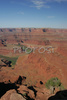 Morning view over Canyonlands from Dead Horse point in Dead Horse Point State park, Utah, USA. Canyonlands preserves a wilderness of rock at the heart of the Colorado Plateau. Water and gravity have been the prime architects of this land, cutting flat layers of sedimentary rock into hundreds of canyons, mesas, buttes, fins, arches, and spires. At center stage are two canyons carved by the Green and Colorado rivers. Surrounding the rivers are vast and very different regions, Island in the Sky on north, the Maze at west and the Needles at east. Canyonlands national park is located near Moab, Utah, USA.
