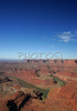 Morning view over Canyonlands from Dead Horse point in Dead Horse Point State park, Utah, USA. Canyonlands preserves a wilderness of rock at the heart of the Colorado Plateau. Water and gravity have been the prime architects of this land, cutting flat layers of sedimentary rock into hundreds of canyons, mesas, buttes, fins, arches, and spires. At center stage are two canyons carved by the Green and Colorado rivers. Surrounding the rivers are vast and very different regions, Island in the Sky on north, the Maze at west and the Needles at east. Canyonlands national park is located near Moab, Utah, USA.
