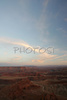 Sunset over Canyonlands, Utah, USA, from Dead Horse Point in Dead Horse Point State park, Utah, USA. Canyonlands preserves a wilderness of rock at the heart of the Colorado Plateau. Water and gravity have been the prime architects of this land, cutting flat layers of sedimentary rock into hundreds of canyons, mesas, buttes, fins, arches, and spires. At center stage are two canyons carved by the Green and Colorado rivers. Surrounding the rivers are vast and very different regions, Island in the Sky on north, the Maze at west and the Needles at east. Canyonlands national park is located near Moab, Utah, USA.
