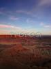 Sunset over Canyonlands, Utah, USA, from Dead Horse Point in Dead Horse Point State park, Utah, USA. Canyonlands preserves a wilderness of rock at the heart of the Colorado Plateau. Water and gravity have been the prime architects of this land, cutting flat layers of sedimentary rock into hundreds of canyons, mesas, buttes, fins, arches, and spires. At center stage are two canyons carved by the Green and Colorado rivers. Surrounding the rivers are vast and very different regions, Island in the Sky on north, the Maze at west and the Needles at east. Canyonlands national park is located near Moab, Utah, USA.
