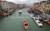 View to busy Grand Canal (Canal Grande) from the Rialto Bridge in Venice, Italy. The Rialto Bridge (Ponte di Rialto) is one of the four bridges spanning the Grand Canal in Venice, Italy. It is the oldest bridge across the canal, and was the dividing line for the districts of San Marco and San Polo. 
