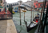 The Rialto Bridge (Ponte di Rialto) is one of the four bridges spanning the Grand Canal in Venice, Italy. It is the oldest bridge across the canal, and was the dividing line for the districts of San Marco and San Polo. 
