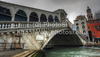 The Rialto Bridge (Ponte di Rialto) is one of the four bridges spanning the Grand Canal in Venice, Italy. It is the oldest bridge across the canal, and was the dividing line for the districts of San Marco and San Polo. 
