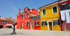 Burano is an island in the Venetian Lagoon, Italy. Like Venice itself, it could more correctly be called an archipelago of four islands linked by bridges. It is situated near Torcello at the northern end of the Lagoon, and is known for its lacework and brightly colored homes. <br> Small, brightly-painted houses on Burano follow a specific system originating from the golden age of its development. If someone wishes to paint their home, one must send a request to the government, who will respond by making notice of the certain colors permitted for that lot.

