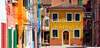 Burano is an island in the Venetian Lagoon, Italy. Like Venice itself, it could more correctly be called an archipelago of four islands linked by bridges. It is situated near Torcello at the northern end of the Lagoon, and is known for its lacework and brightly colored homes. <br> Small, brightly-painted houses on Burano follow a specific system originating from the golden age of its development. If someone wishes to paint their home, one must send a request to the government, who will respond by making notice of the certain colors permitted for that lot.
