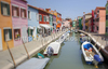 Burano is an island in the Venetian Lagoon, Italy. Like Venice itself, it could more correctly be called an archipelago of four islands linked by bridges. It is situated near Torcello at the northern end of the Lagoon, and is known for its lacework and brightly colored homes. <br> Small, brightly-painted houses on Burano follow a specific system originating from the golden age of its development. If someone wishes to paint their home, one must send a request to the government, who will respond by making notice of the certain colors permitted for that lot.
