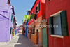 Burano is an island in the Venetian Lagoon, Italy. Like Venice itself, it could more correctly be called an archipelago of four islands linked by bridges. It is situated near Torcello at the northern end of the Lagoon, and is known for its lacework and brightly colored homes. <br> Small, brightly-painted houses on Burano follow a specific system originating from the golden age of its development. If someone wishes to paint their home, one must send a request to the government, who will respond by making notice of the certain colors permitted for that lot.
