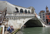 The Rialto Bridge (Ponte di Rialto) is one of the four bridges spanning the Grand Canal in Venice, Italy. It is the oldest bridge across the canal, and was the dividing line for the districts of San Marco and San Polo. 
