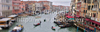 View to busy Grand Canal (Canal Grande) from the Rialto Bridge in Venice, Italy. The Rialto Bridge (Ponte di Rialto) is one of the four bridges spanning the Grand Canal in Venice, Italy. It is the oldest bridge across the canal, and was the dividing line for the districts of San Marco and San Polo. 
