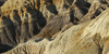 Blue Mesa badlands and washes in Petrified Forest National Park. Blue Mesa is crown jewel of Petrified Forest National park, with trail winding through colorful eroded  badlands. Petrified Forest National park preserves the largest concentration of petrified wood in North America, perhaps in the World. What sets it apart from other petrified wood sites is its scenic surroundings of badlands, which provide an otherworldly feeling to the experience. Petrified Forest National park is situated approximately 20 miles east of Holbrook, AZ, USA