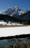Zelenci springs are still covered with snow in late March. <br> Zelenci Springs is the source of the river Sava near Kranjska Gora in northwestern Slovenia. At Zelenci Springs, water from an underground stream originating in the Planica Valley re-emerges via a two-metre deep green lake. The area gets its name from this brilliant green colour (Zelen means green in Slovene). Zelenci is a nature reserve since 1992 and is home to many endangered animal and plant species. <br> The lake formed by the springs has a constant temperature of between 5 and 6C all year round. From the lake, the water runs into a 200-metre wide and one-kilometre long marshland. The actual riverbed is not formed until after this at Podkoren, below Vitranc.

