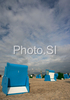 Beach chairs are abandoned in windy summer evening on sandy beaches of North Germanys tourist resort Warnemunde. Temperatures around +18 degres of Celsius and strong wind made bathers to leave early, and wind had its own way to play with sand and beach equipment on endless Baltic sandy beaches.
