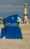 Beach chairs are abandoned in windy summer evening on sandy beaches of North Germanys tourist resort Warnemunde. Temperatures around +18 degres of Celsius and strong wind made bathers to leave early, and wind had its own way to play with sand and beach equipment on endless Baltic sandy beaches.
