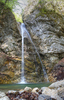 18m high Tominec waterfall (Tomincev slap) is located in small gorge near village Podljubelj, just out of Trzic, Slovenia. Small waterfall is surrounded by trees and gives real feel of nature with just sound of falling water and music of birds singing in trees around the waterfall and small pond under it.

