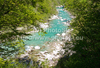Soca river is flowing through gorges near village Lepena, Slovenia. Early morning sun is shining through tree leaves on morning of Friday, 22nd of April 2011.
