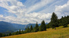 View to Bohinj lake from mountain meadows just under the top of Rudnica mountain. Rudnica is 946m high mountain located on ridge dividing upper and lower Bohinj valley, offering beautiful views to Julian Alps mountains, and villages of lower and upper Bohinj valley.
