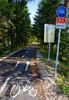 D-2 cycling path leading cyclists into forrest along the old railroad track near village of Martuljek, Slovenia, on sunny autumn day, when high mountains around were already covered with early snow.
