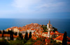 View to city of Piran, Slovenia, from walls above city. The city resembles a large open-air museum, with medieval architecture and a rich cultural heritage. Narrow streets and compact houses give the town its special charm.
