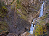 Martuljek stream follows its path through a 500 meters long ravine dropping over the 50 meters high rock face as the Lower Martuljek waterfall onto a 400 meters long but narrow Martuljek canyon carved into lime rock. 
