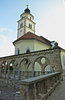 Plecnik arcades and Rosary church Rozenvenska cerkev, Cankarjeva ulica, Kranj <br>   <br> In the first decade of the 16th century, this succursal church dedicated to the Holy Mother of the Rosary was built above the lower city gate. In the 1570s, the church served as a place of worship for Protestants and during this period all its original furnishings were lost. The church was restored in the 17th century. The church is an ordinary example of Late Gothic architecture with a rectangular nave and somewhat narrower presbytery. The presbytery and nave have Gothic vaulting. In 1892, the church was completely renovated in the historicist style, and thus a great many of the historical features were removed. However, the church is still an important element of the view of the city and a dominant feature of the old city. <br> 
