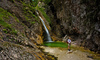 Zapotok waterfall is located on the end of Upper Trenta valley, Slovenia, and was created by Suhi Potok stream. Its surrounded by Prisank, Razor and Bavski Grintavec mountains.
