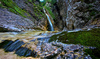 Zapotok waterfall is located on the end of Upper Trenta valley, Slovenia, and was created by Suhi Potok stream. Its surrounded by Prisank, Razor and Bavski Grintavec mountains.
