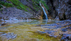 Zapotok waterfall is located on the end of Upper Trenta valley, Slovenia, and was created by Suhi Potok stream. Its surrounded by Prisank, Razor and Bavski Grintavec mountains.
