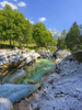 Emerald green Soca river is flowing through deep and narrow gorge near vas Soca, Slovenia.
