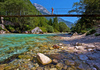 Emerald green Soca river is flowing through deep and narrow gorge near vas Soca, Slovenia.
