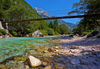 Emerald green Soca river is flowing through deep and narrow gorge near vas Soca, Slovenia.
