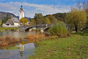 Church of  Sv. Janeza Krstnika (St. John The Baptist) in Bohinj, Slovenia, surrounded by trees already painted in autumn colors on Saturday, 17th of October 2015.
