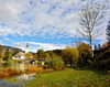 Church of  Sv. Janeza Krstnika (St. John The Baptist) in Bohinj, Slovenia, surrounded by trees already painted in autumn colors on Saturday, 17th of October 2015.
