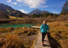 Nordic walking around Zelenci spring, near Kranjska Gora, Slovenia. Zelenci is a spring and nature reserve near village of Kranjska Gora, Slovenia. Zelenci spring is source of Sava river. At Zelenci, water from the underground stream Nadiza emerges through the porous lake bottom, whose waters are noted for their deep, brilliant green. The spring and its surrounding area are named after this color, as zelen meaning green in Slovene. 
