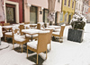 Outdoor cafe tables and chairs under a carpet of snow in Kranj February 2016
