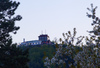 Evening view from Kranj, Zlato Polje towards Smarjetna Gora (Mount St. Margaret) and Bellevue hotel. Smarjetna Gora  is a hill which rises above Kranj on the right bank of the Sava river.  <br> From the Bellevue hotel terrace, you can see at least one fifth of Slovenia in clear weather. <br> 
