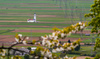 View to church in middle of fields near village of Bitnje, Slovenia, from top of Smarjenta gora, 652m high hill near Kranj, Slovenia on Sunday morning, 24th of April 2016.
