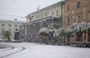 Snowing in Kranj, Slovenia, on 27th of April 2016. <br>  <br> Preserens Monument <br> In the Main square in front of the theatre building decorated by Plecniks arcades is situated bronze statue of the slovene poet Dr. France Preseren.
