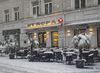 Outdoor cafe tables and chairs under a carpet of snow in Kranj  on 27th of April 2016.
