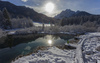 Views to Zelenci spring near Kranjska Gora on sunny morning of Sunday, 15th of January 2017, after snow storm passed Kranjska Gora, Slovenia, and delivered long awaited 30 to 40cm of fresh snow. <br> Zelenci Springs is a nature reserve near the town of Kranjska Gora, in the far northwestern corner of Slovenia. It is the source of the Sava Dolinka River.
