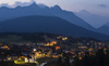 View to Seefeld village, church and village lights in late evening from nearby mountain.
