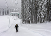 Ski tourers climb up on closed slopes of Pokljuka Visevnik ski resort. Ski lifts are turned off due Covid-19 regulations preventing them to operate, even though theres plenty of snow after snow storm in last few days. Pokljuka and slopes of Visevnik mountain, Slovenia, on morning of 10th of December 2020, after extensive snow fall, which brought more than 1.5m of snow to Julian Alps in less then two days.