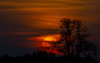 Sunset near Preddvor, Slovenia, while few 100 firefighters, 4 helicopters and firefighting plane that came to help from Croatia, tried to extinguish forest fire that started in mountains above village Potoce near Preddvor, Slovenia on Monday 28th of March 2022. Their efforts were still continuing on Tuesday, 29th of March 2022.