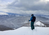 Skier observing snow covered landscape before descending down the slopes of Visevnik mountains above Pokljuka plateau. Winter finally came to Slovenia with heavy snowfall ai middle of January, covering valleys with 10-30cm of snow, while mountains got extra 60 to 80cm deep snow blanket.