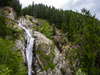 Views to Klammbach waterfall above village of Antholz Mittertal, Italy.