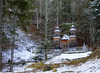 Russian chapel is seen between trees after first snow covered ground on 12th of November 2023. The wooden chapel, dedicated to St. Vladimir was built in 1916 by surviving Russian prisoners of war to commemorate those who died during the construction of the road across Vrsic.