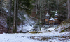 Russian chapel is seen between trees after first snow covered ground on 12th of November 2023. The wooden chapel, dedicated to St. Vladimir was built in 1916 by surviving Russian prisoners of war to commemorate those who died during the construction of the road across Vrsic.